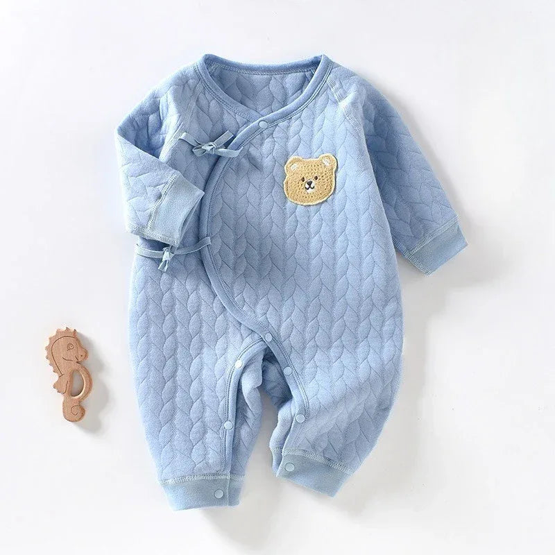 Light blue quilted cotton warm baby romper with long sleeves and bear patch