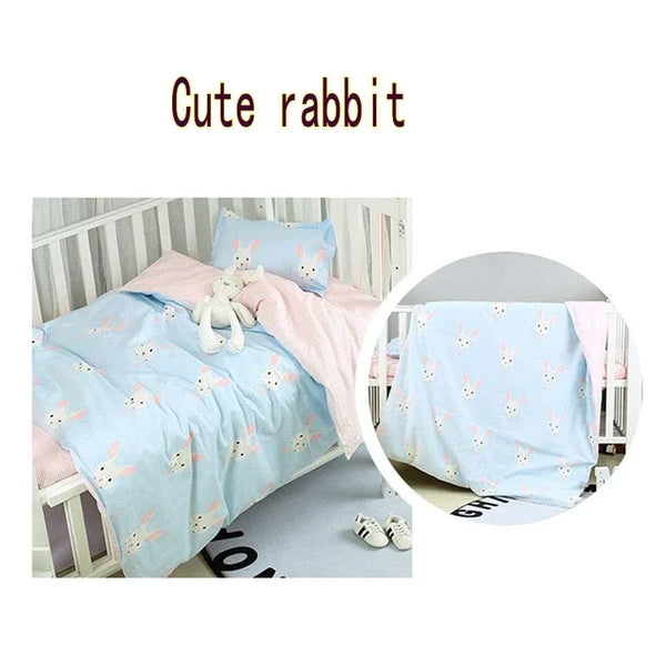 Baby bedding sets with cute rabbit design in light blue and pink for nursery crib