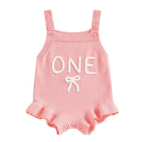 pink baby birthday romper for one year old with 'ONE' text and ruffle trim
