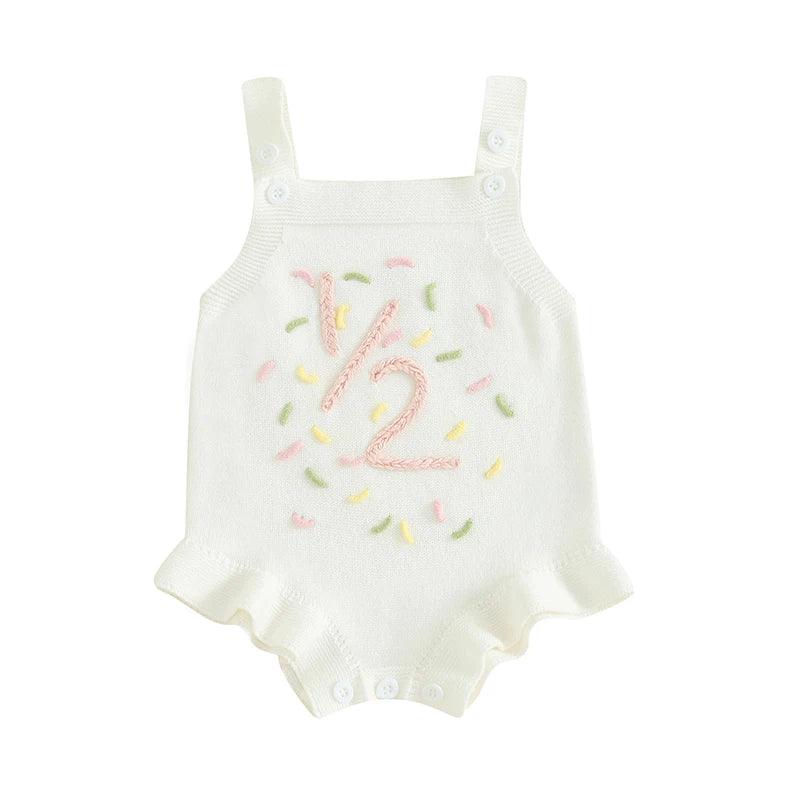 white baby birthday romper with pink number 12 and colorful sprinkles design for infants