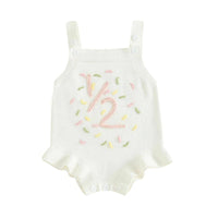 white baby birthday romper with pink number 12 and colorful sprinkles design for infants