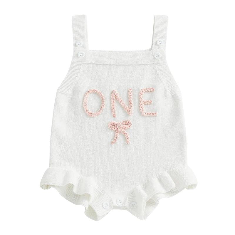 White baby birthday romper for 1 year old with pink ONE embroidery and ruffled leg openings