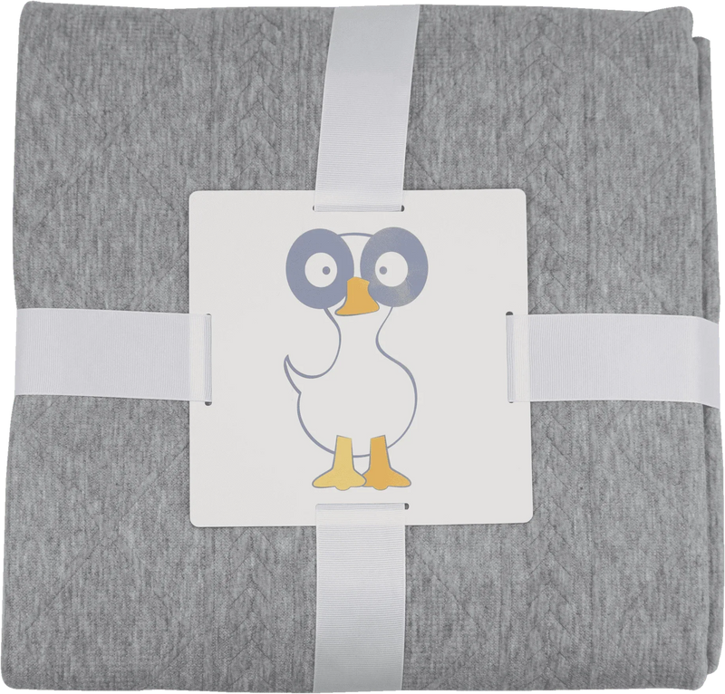 Soft gray knit baby blanket made from cozy material, neatly folded with a duck illustration tag