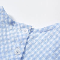 baby blue gingham party dress close-up showing white buttons and collar detail
