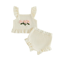 cream baby girl two-piece outfit with pink flower embroidery and ruffle details for infant