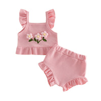 Baby girl pink textured two-piece outfit with floral embroidery and ruffled sleeves and shorts