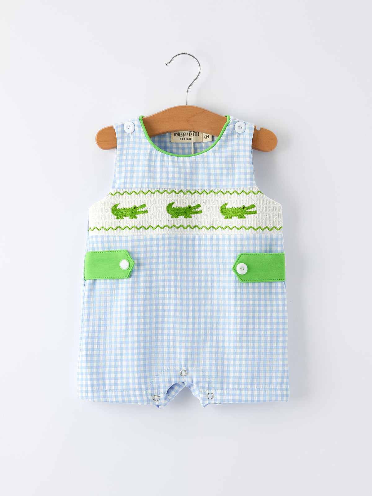 Rylee Faith Designs baby boys crocodile smocked romper in blue gingham with green crocodile embroidery and snap closures