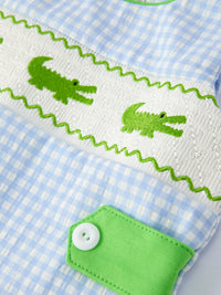 Rylee Faith Designs baby boys crocodile smocked romper in blue gingham with green crocodile embroidery and button detail