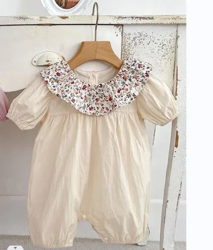 Cream baby bubble rompers with floral ruffle collar and short puff sleeves for infants