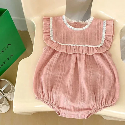 Pink baby bubble rompers with lace trim and ruffle sleeve detail for infants