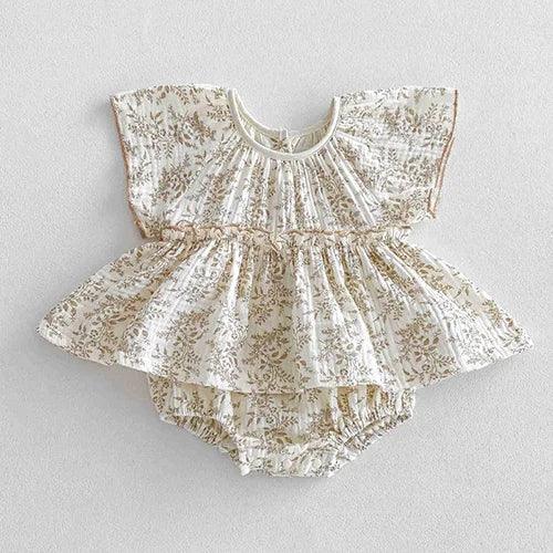 Cream floral baby bubble rompers with short sleeves and ruffle detail for infants