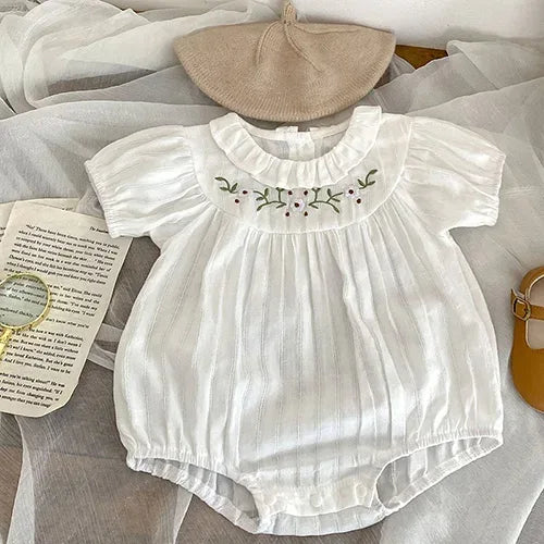 White baby bubble rompers with floral embroidery and ruffled collar for infants