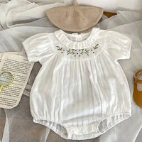 White baby bubble rompers with floral embroidery and ruffled collar for infants