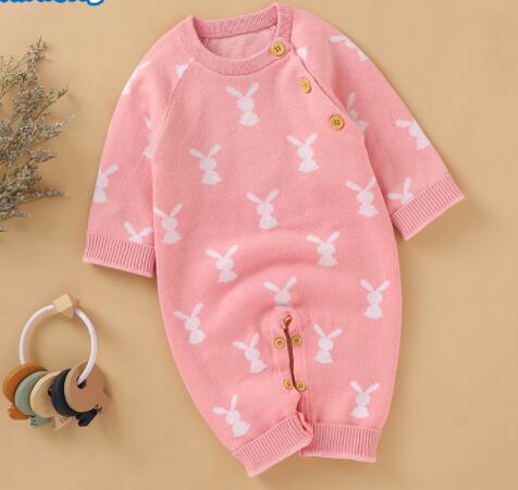pink baby bunny knit romper for infants with white bunny pattern and button details