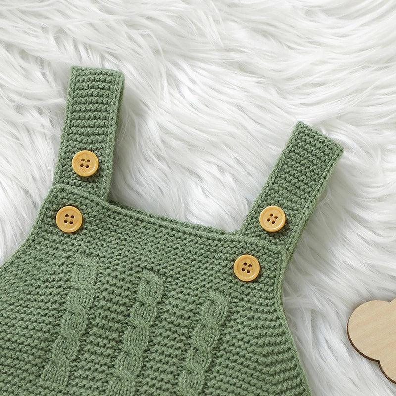 Green knitted baby cardigan and overalls outfit with wooden buttons for infants