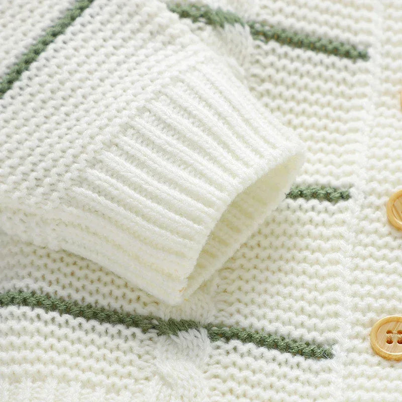 Cream and green knit baby cardigan with wooden buttons and textured sleeve cuff baby cardigan and overalls outfit