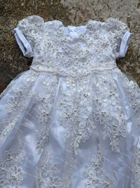 White baby christening gown with bonnet featuring lace and pearl details for newborns