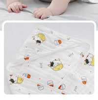 White baby envelope wrap with yellow and black cow print and orange details for newborns and infants