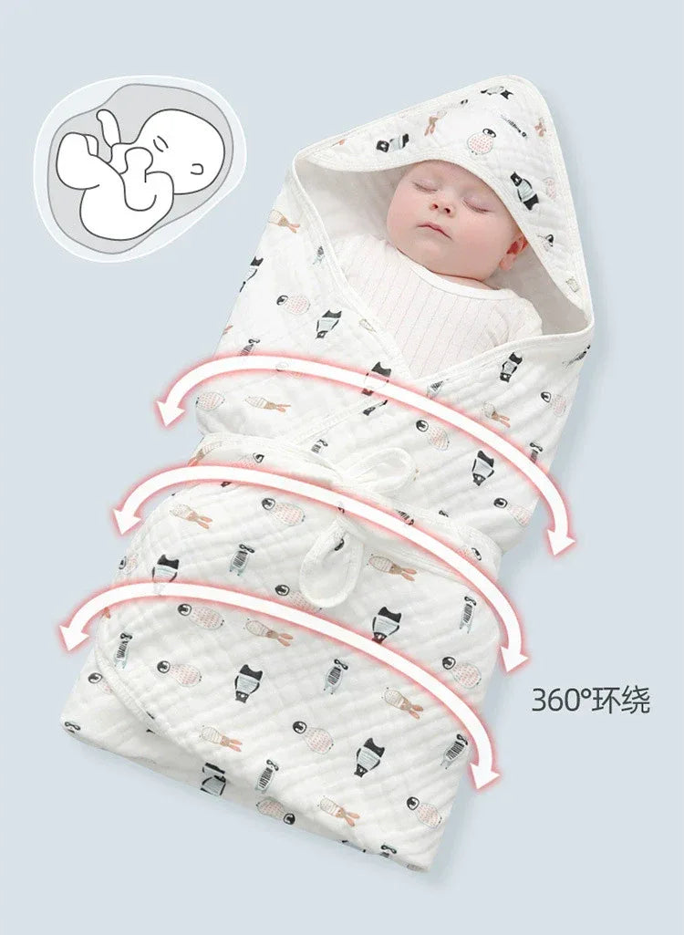 White baby envelope wrap with black and orange animal prints for newborns, featuring a hood and full swaddle design