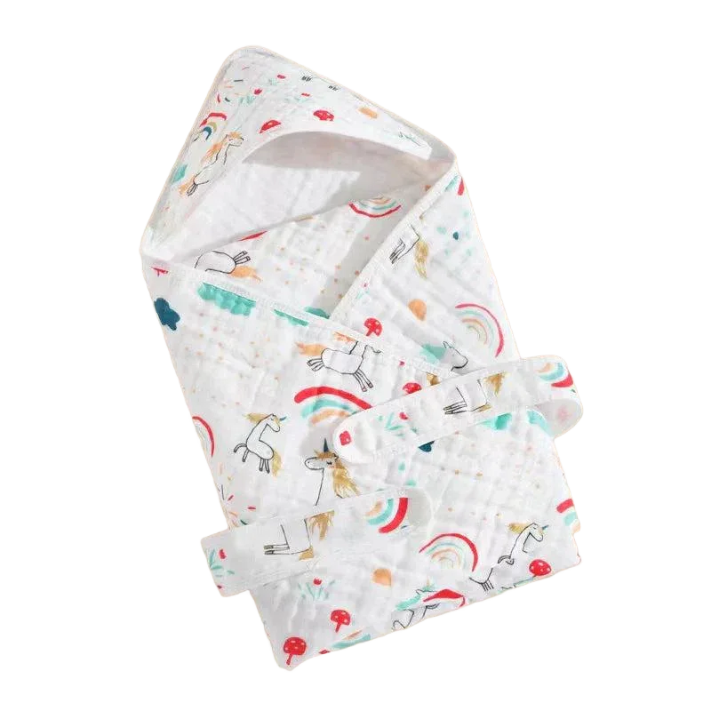 White baby envelope wrap for newborns with colorful unicorn and rainbow print