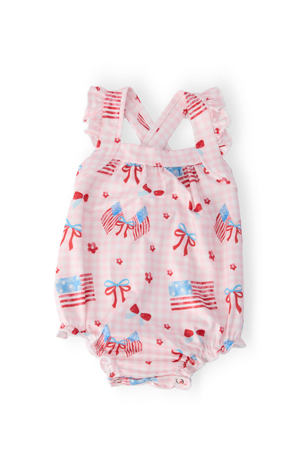 baby romper ruffle with red white and blue American flag print and cross back straps