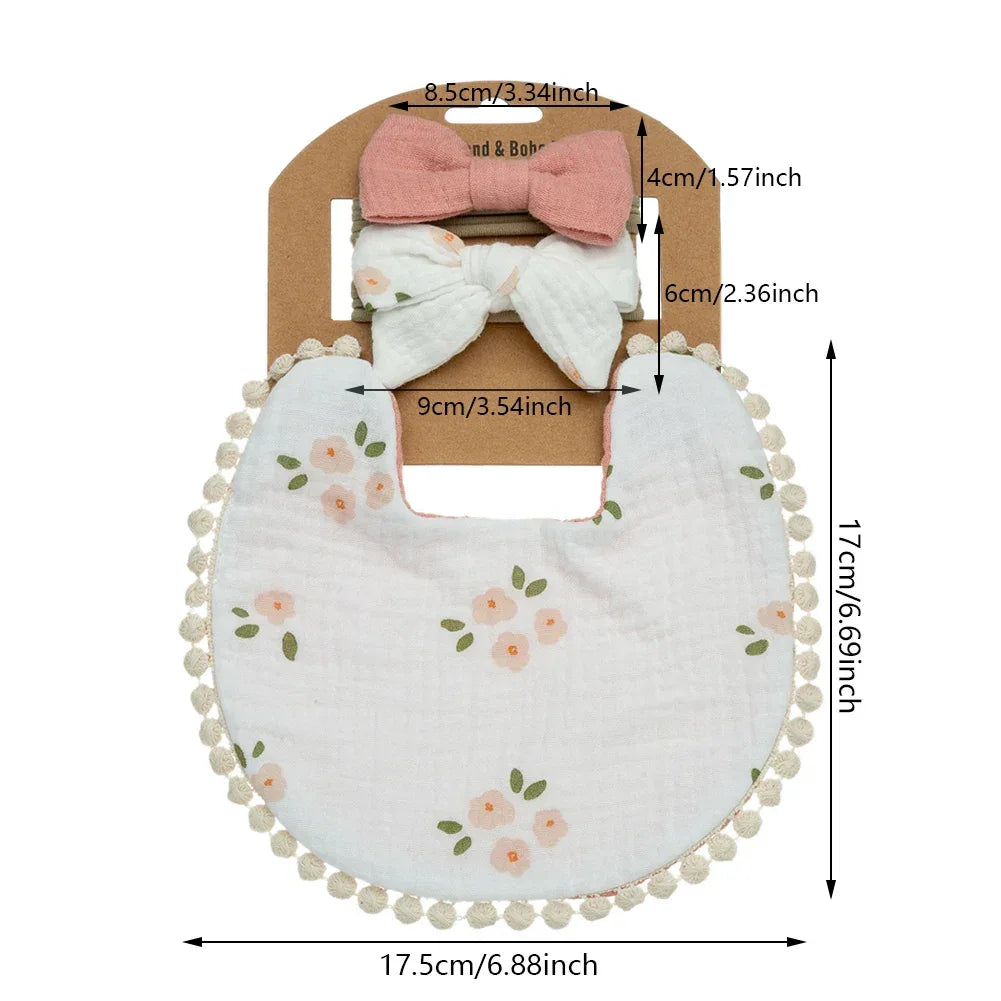 white baby flower bib and headband set with pink floral print and pompom trim for infants