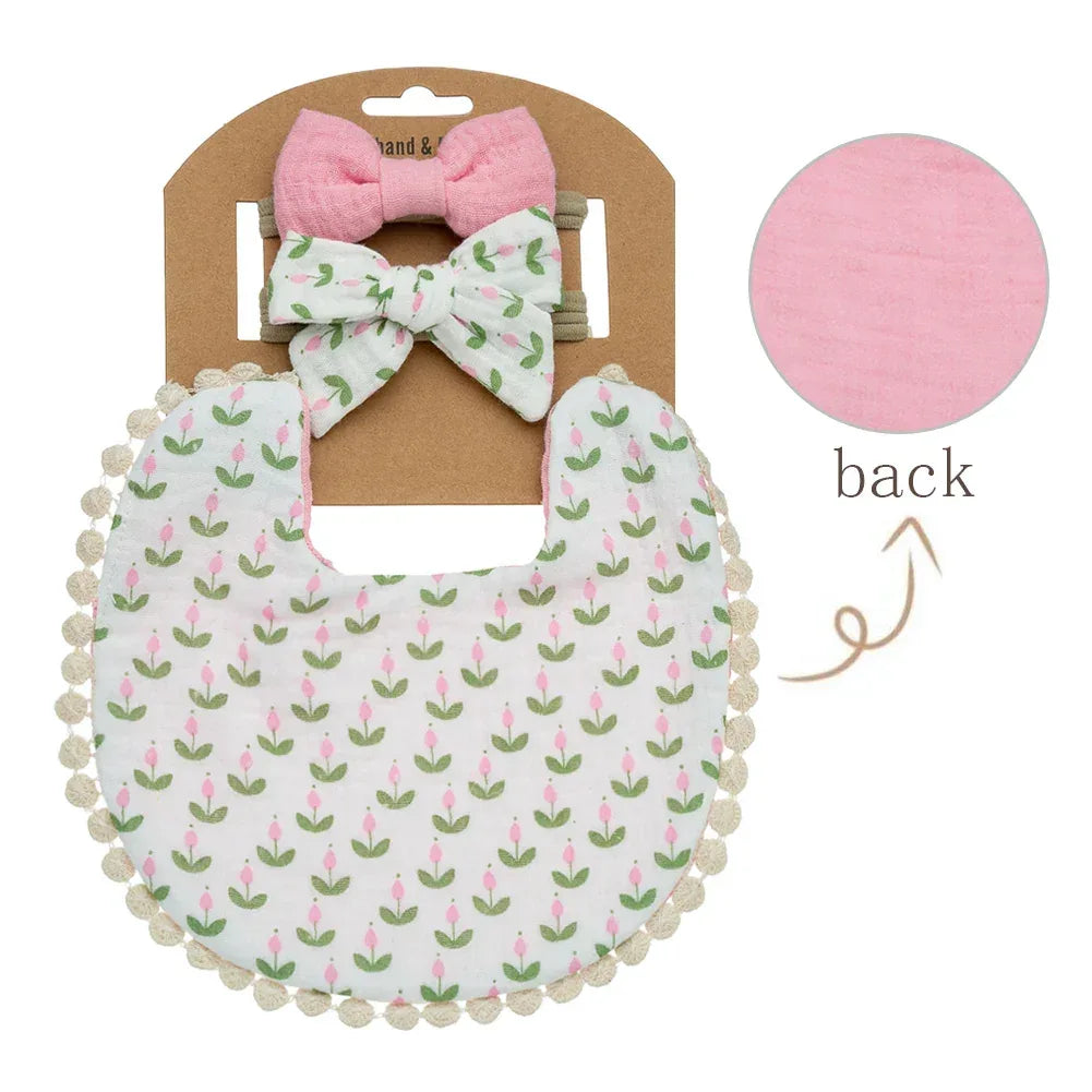 baby flower bib and headband set with pink and white floral pattern for infants with two bow headbands