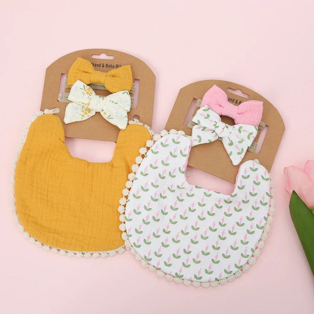 Two baby flower bib and headband set in mustard yellow and white with pink floral pattern for infants