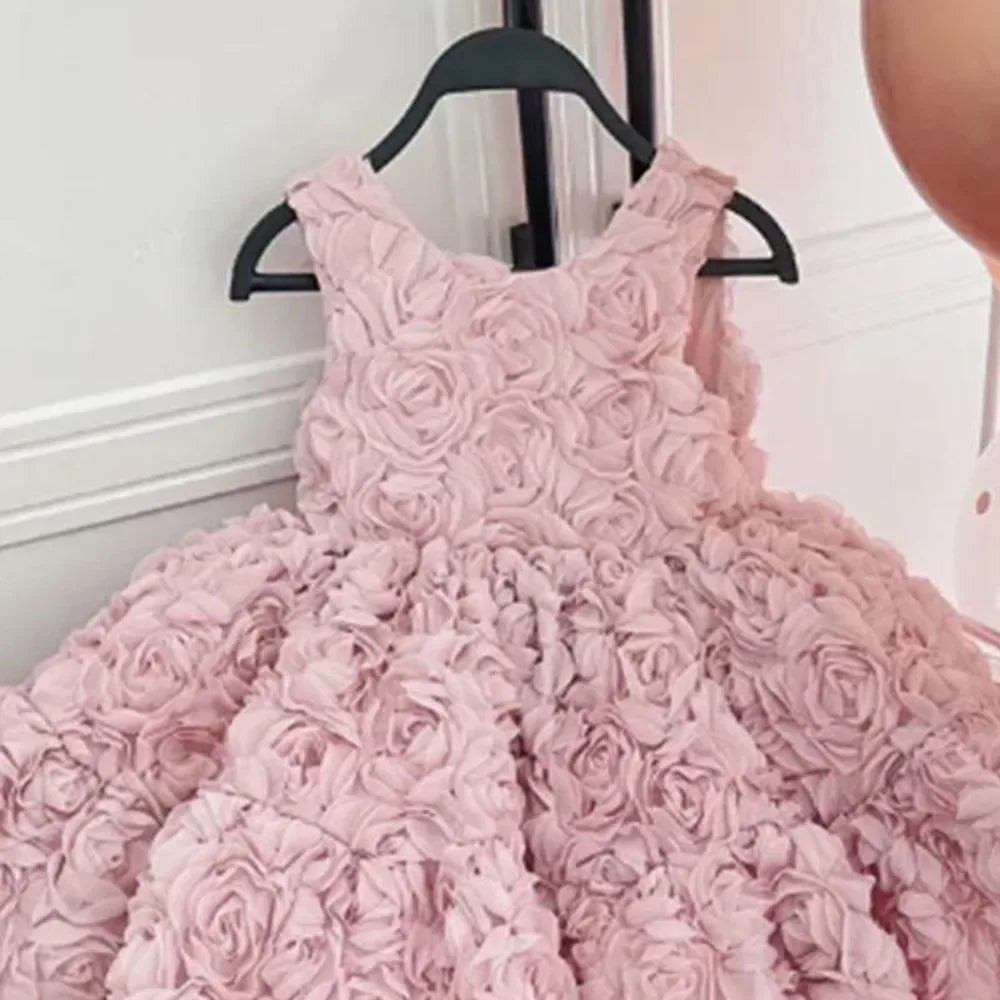 Pink baby girl party dress with 3D floral rosette design for infants and toddlers
