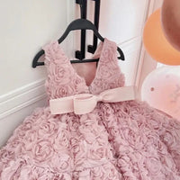 Pink baby girl party dress with 3D rosette texture and wide bow for toddlers