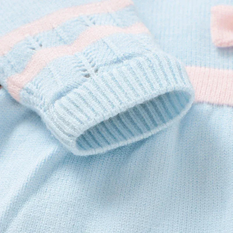 Baby blue knit dress with pink accents, soft knit fabric for infants, delicate sleeve cuff detail