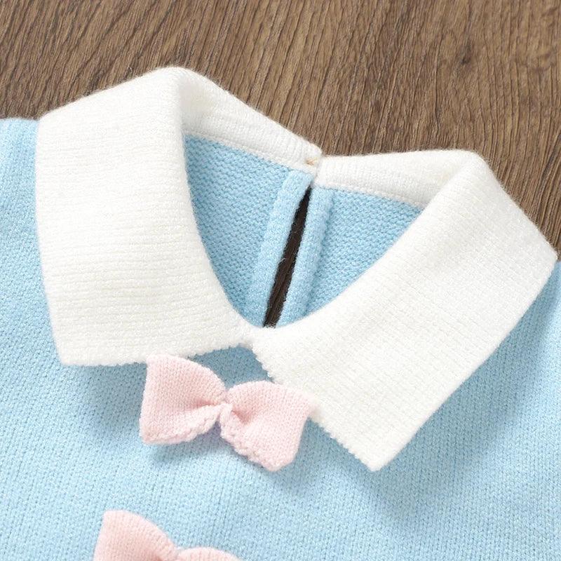 baby blue knit dress with white collar and pink bow detail for infants
