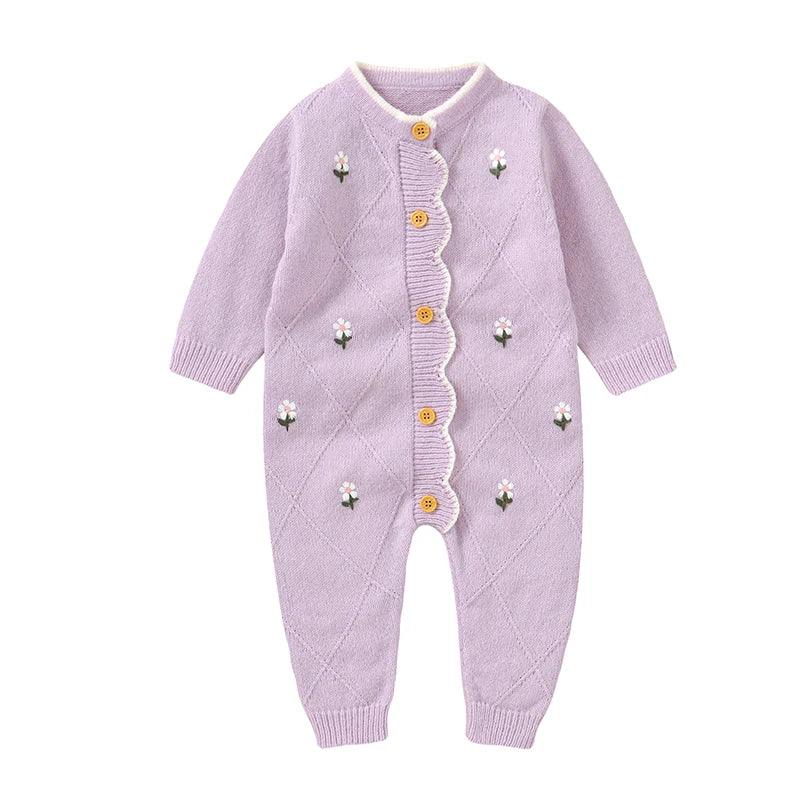 Lilac baby knit romper with flower design made of soft knitted fabric with wooden buttons