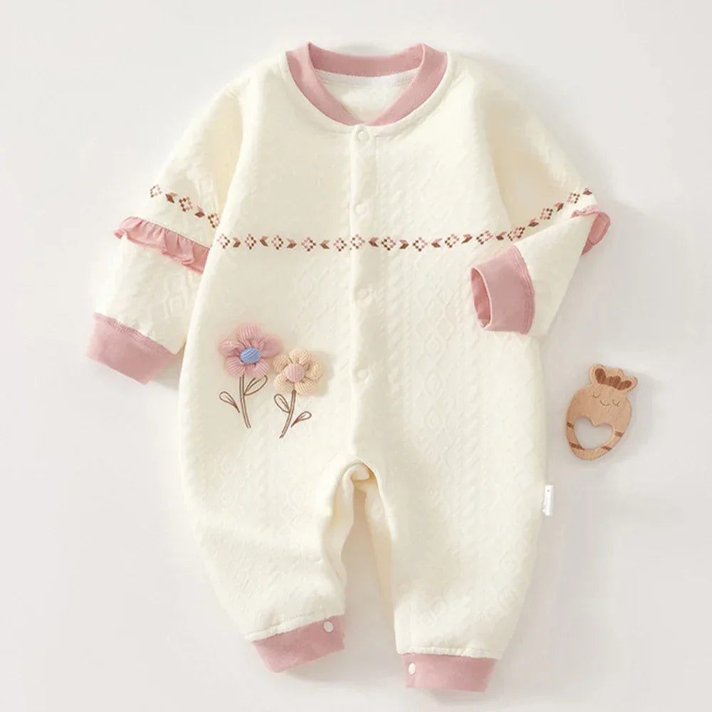 Cream baby knitted flower romper with pink trim made of soft knit fabric for infants