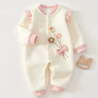 White and pink baby knitted flower romper made of soft knit fabric with floral embroidery and ruffle details