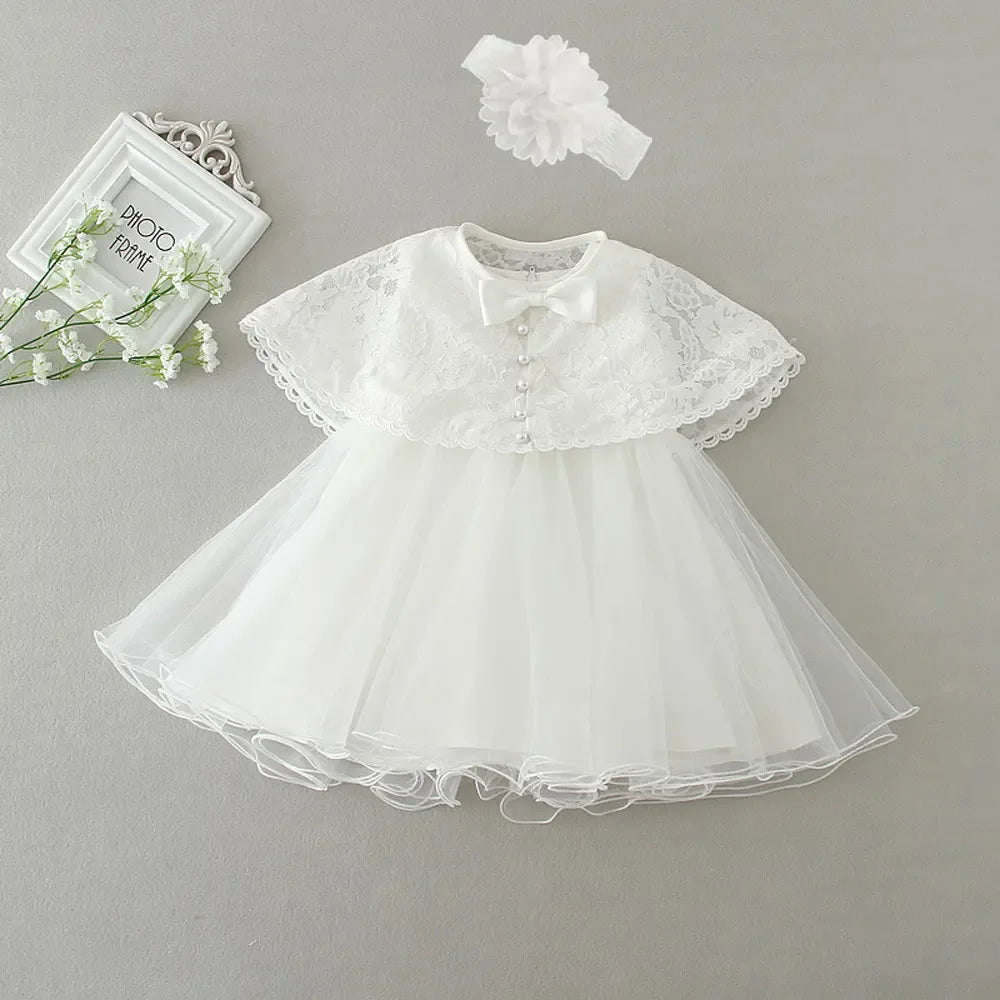 White baby lace special occasion dress with pearl buttons and matching headband for infants