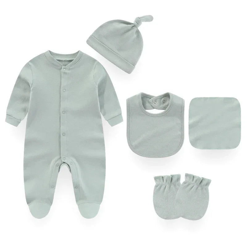 baby layette set in soft light green for newborns including footed sleeper hat bib mittens and cloth