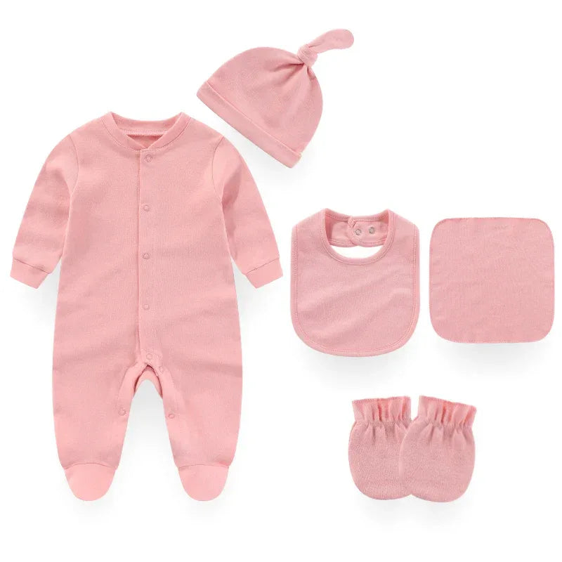 Pink baby layette set including footed sleeper, hat with knot, bib, washcloth, and mittens for newborns