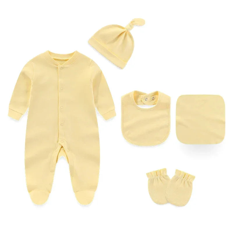 yellow baby layette set including footed romper, hat, bib, mittens, and washcloth for newborns