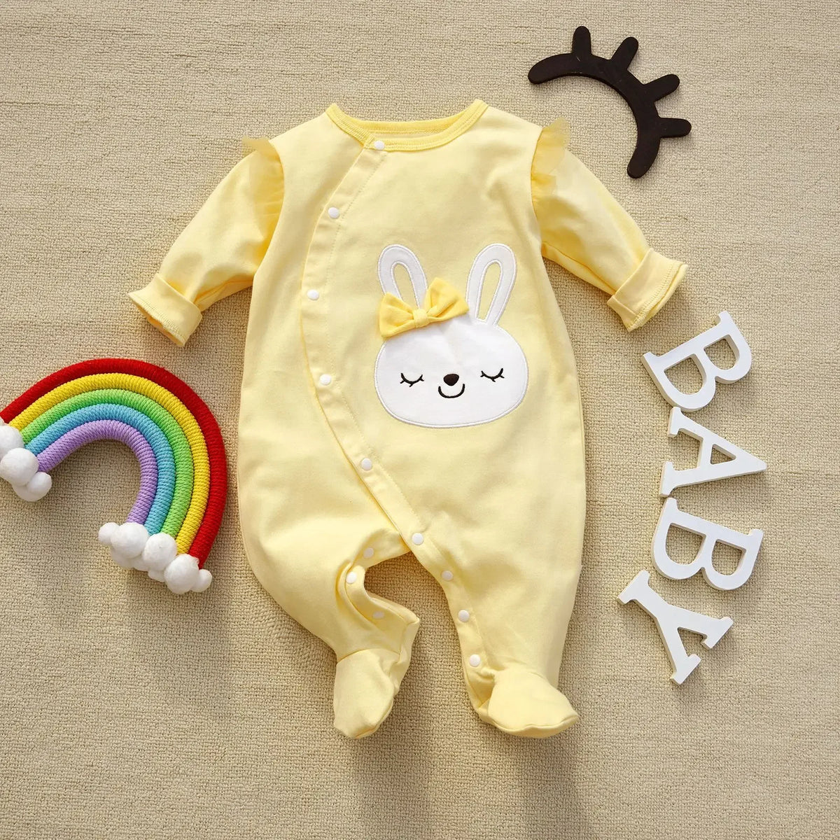 yellow baby romper with long sleeves and bunny face applique for infants