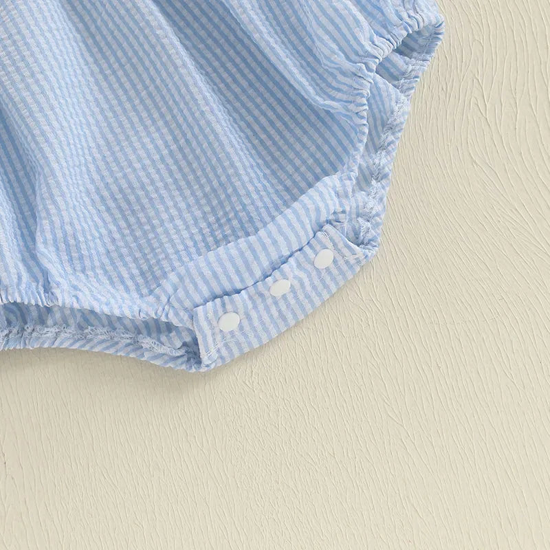 close up of blue and white striped baby romper with snap buttons for infants