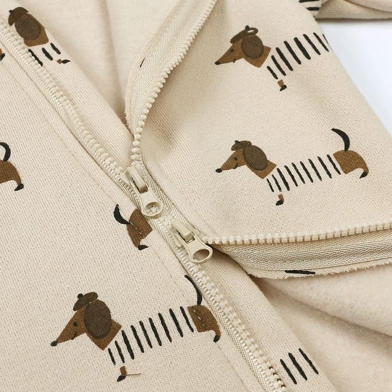 beige baby zip-up onesie with brown dachshund dog print for infants