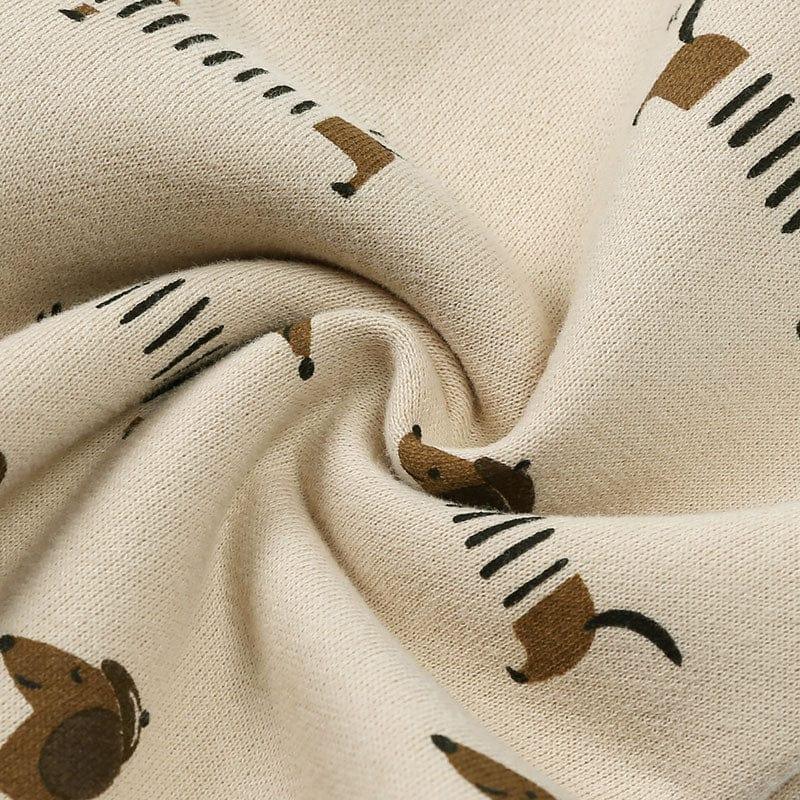 beige baby fabric with brown dog print for infants and toddlers soft cotton material