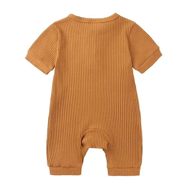 baby romper in tan ribbed fabric with short sleeves and cuffed legs for infants