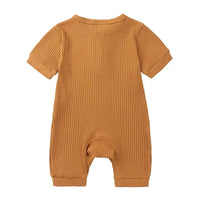 baby romper in tan ribbed fabric with short sleeves and cuffed legs for infants