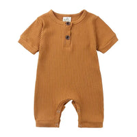 tan ribbed baby romper with short sleeves and button details for infants