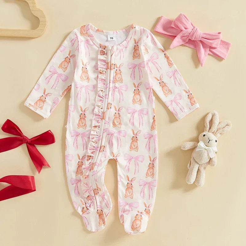 White baby romper with pink bows and bunny prints for infants, long sleeve and footed design