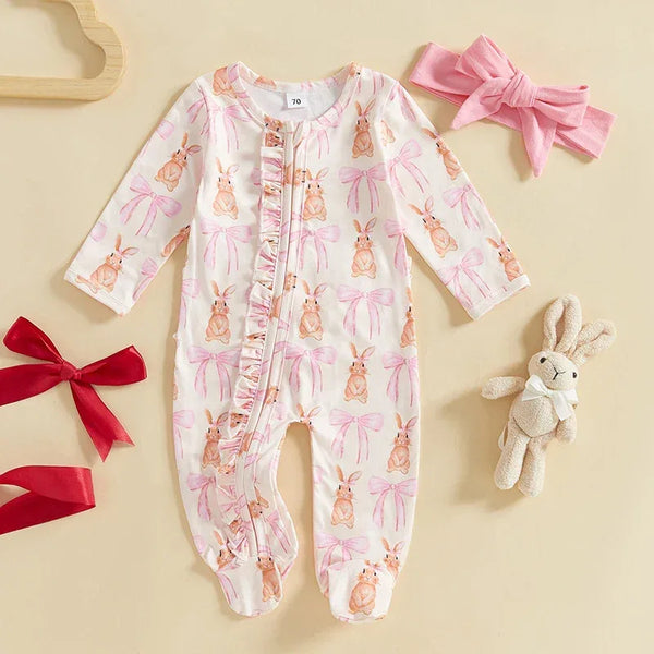 White baby romper with pink bows and bunny prints for infants, long sleeve and footed design