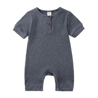 baby romper in dark gray ribbed fabric with short sleeves and button details for infants