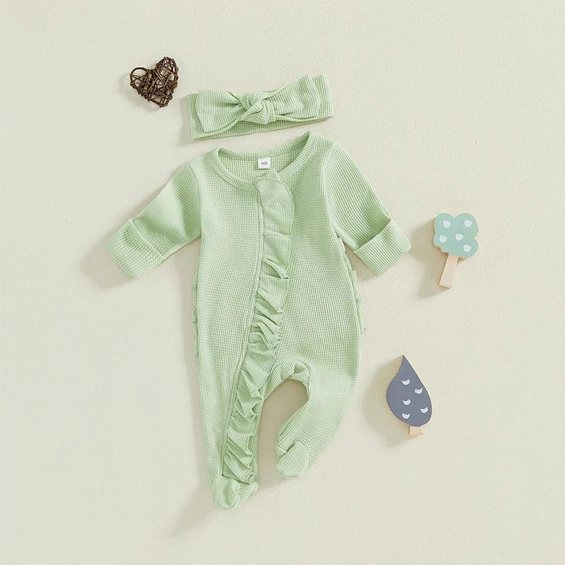 baby green romper with ruffle detail and matching headband for infants